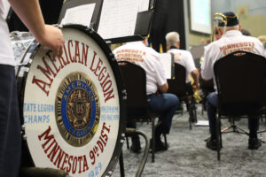 The words "American Legion Minnesota 9th District" appear on the side of a bass drum.