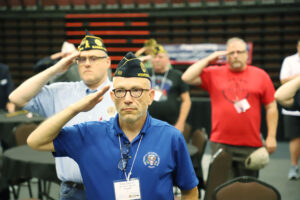 Legionnaires at the convention salute the colors during the playing of “The Star-Spangled Banner” on July 15.