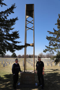 Chanhassen Post 580 member Dick Middleton and Post 580 Commander Glen Anderson stand beside the carillon at Fort Snelling National Cemetery. 