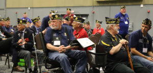 Legion member Ken Meyer of Pequot Lakes Post 49 looks for an incoming presenter at the convention.