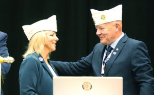 Department Membership Director Pam Krill and Department Commander Paul Hassing stand at the podium together shortly after their election in mid-July.