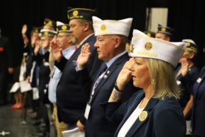 Membership Director Pam Krill and other officers raise their right hands on July 15.