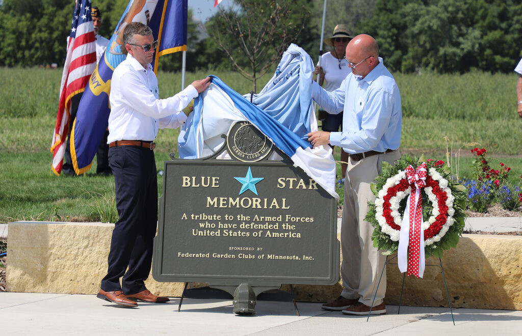 The Blue Star Memorial for the new cemetery is unveiled.