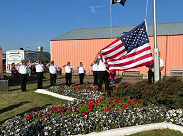 Barnum Post 415 members perform a flag-raising ceremony at the Carlton County Fair.