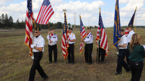 Men walk with flags.