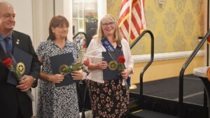 Bonnie Luedloff from Waconia Unit 150 was recognized at the 102nd National Convention, in Charlotte, at the annual luncheon. Luedloff, near the U.S. flag, is pictured with other Department of Member of the Year recipients.