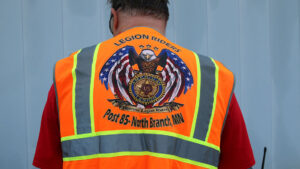 This orange safety vest with a flag-winged eagle says, “Legion Riders” and says “Post 85 North Branch, MN.”