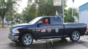Bill and Mary Kuperus drive the chase vehicle away from the starting point, North Branch Post 85, on July 26.