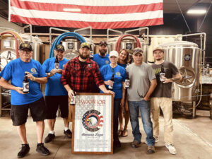 Members of Lawrence Lake Township Post 467 stand with beer they brewed in early August at Warrior Brewing in Duluth.