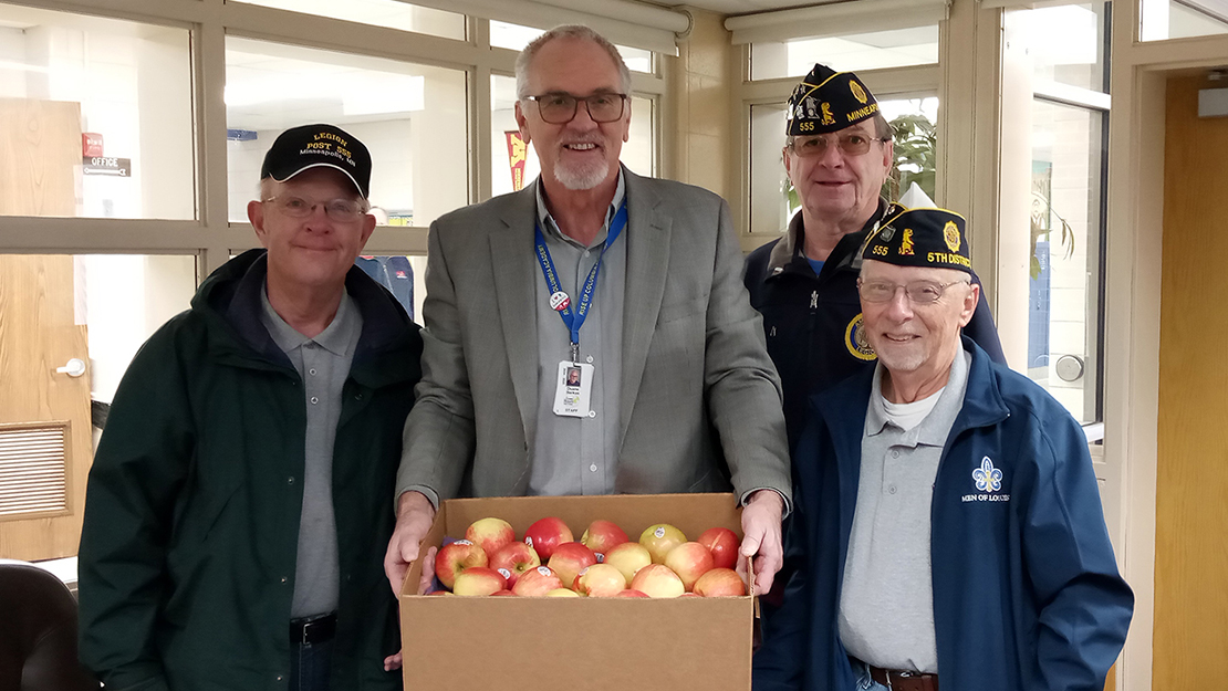 Go to Minneapolis Falldin Post 555 delivers apples to elementary school